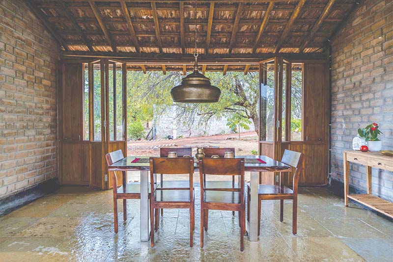 Earthy Farmhouse Design Weaved Around A Traditional Courtyard